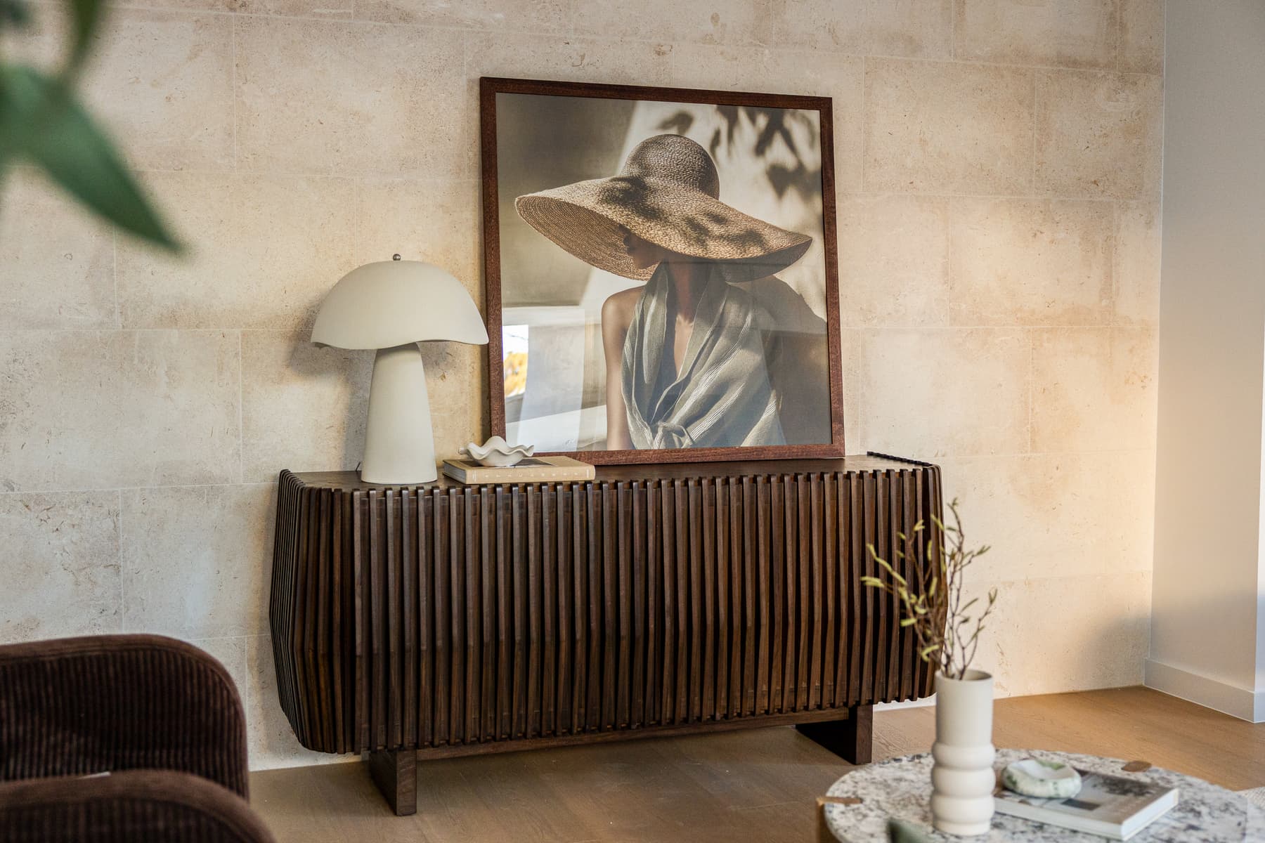 Interior still life with lamp and framed artwork